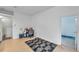 This room offers a versatile space with neutral walls, laminate flooring, and a convenient adjacent bathroom at 4611 Anaconda Dr, New Port Richey, FL 34655