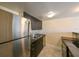 Condo kitchen with modern stainless steel appliances and sleek, dark cabinetry at 5820 N Church Ave # 430, Tampa, FL 33614