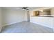 Light-filled living room featuring modern lighting, an open layout, and sleek tile flooring at 5820 N Church Ave # 430, Tampa, FL 33614