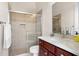 Bathroom featuring a marble-top vanity and a glass-enclosed walk-in shower at 603 Viento De Avila, Tampa, FL 33613