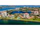 Stunning aerial view of waterfront condos and beautiful blue water with bridges and lush greenery at 6290 Bahia Del Mar Cir # 5, St Petersburg, FL 33715