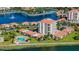 Scenic aerial view of the coastal residential property with its large community pool and surrounding landscape at 6290 Bahia Del Mar Cir # 5, St Petersburg, FL 33715