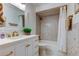Bathroom features white vanity, shower/tub combination, and detailed tile work at 6290 Bahia Del Mar Cir # 5, St Petersburg, FL 33715
