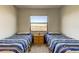 Bedroom with twin beds, a view, and a small table between the beds at 6290 Bahia Del Mar Cir # 5, St Petersburg, FL 33715