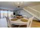Bright dining area with access to a waterfront deck, complemented by modern furnishings at 6290 Bahia Del Mar Cir # 5, St Petersburg, FL 33715