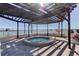 Relaxing outdoor hot tub area featuring a pergola and views of the water at 6290 Bahia Del Mar Cir # 5, St Petersburg, FL 33715