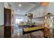 Modern kitchen with dark countertops, white cabinets, and open view to dining area at 6290 Bahia Del Mar Cir # 5, St Petersburg, FL 33715