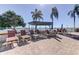 Inviting outdoor deck area with seating and lounge chairs and an ocean view at 6290 Bahia Del Mar Cir # 5, St Petersburg, FL 33715