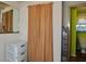 Bright bathroom featuring a toilet, and an open mirror at 7043 Lang St, Brooksville, FL 34601