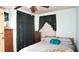 Inviting bedroom with a comfortable bed, dresser, and soft lighting at 7043 Lang St, Brooksville, FL 34601