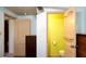Hallway view leading to an adjacent brightly painted bathroom and bedroom at 7043 Lang St, Brooksville, FL 34601
