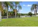 Backyard features a lush green lawn and a picturesque lake view at 7210 N Manhattan # 1822, Tampa, FL 33614