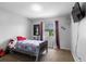 Bedroom with neutral carpet, large window, and bed at 7210 N Manhattan # 1822, Tampa, FL 33614