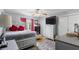 Bedroom with a ceiling fan, large TV, window, and a plush rug on the floor at 7210 N Manhattan # 1822, Tampa, FL 33614