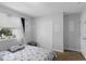 Bedroom featuring neutral carpet, large window, and simple decor at 7210 N Manhattan # 1822, Tampa, FL 33614