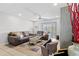 The open-concept living room features a large seating area, modern decor, and ample natural light at 7210 N Manhattan # 1822, Tampa, FL 33614