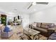 The living room has an open layout with a modern ceiling fan and blends seamlessly with the dining area and kitchen at 7210 N Manhattan # 1822, Tampa, FL 33614