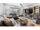 The spacious living room is complete with stylish decor, comfortable seating, and a ceiling fan at 7210 N Manhattan # 1822, Tampa, FL 33614