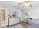 Bedroom with silver furnishings, carpet, and attached bathroom entrance at 7210 N Manhattan # 1822, Tampa, FL 33614