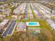 Aerial view of a well-maintained community with a pool and recreational area, surrounded by lush landscaping at 8460 Calais N # 8406, Pinellas Park, FL 33781