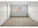 Bedroom with neutral carpeting, window views, and closet spaces for serene relaxing living at 8460 Calais N # 8406, Pinellas Park, FL 33781