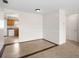 Open dining area featuring tile flooring that leads into the kitchen, seamlessly connecting the spaces with light walls at 8460 Calais N # 8406, Pinellas Park, FL 33781