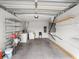 Spacious garage with laundry machines, shelving, and room for storage at 8460 Calais N # 8406, Pinellas Park, FL 33781