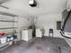 Spacious garage with laundry machines, shelving, and room for storage at 8460 Calais N # 8406, Pinellas Park, FL 33781