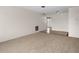 Inviting carpeted living room with tile flooring transitions seamlessly into the next room, offering a bright and open layout at 8460 Calais N # 8406, Pinellas Park, FL 33781
