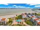 Stunning aerial view of beachfront condos with a swimming pool overlooking the bay at 855 Bayway Blvd # 105, Clearwater, FL 33767
