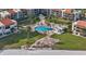 A scenic aerial view of the complex features a pool, common areas and beachfront access at 855 Bayway Blvd # 105, Clearwater, FL 33767