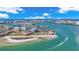 Aerial view of beachfront condos with boats on the water and clear skies at 855 Bayway Blvd # 105, Clearwater, FL 33767