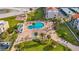 An aerial of a community pool and outdoor recreation area near a playground at 855 Bayway Blvd # 105, Clearwater, FL 33767