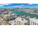 Aerial view of condos with parking and overlooking waterfront with marina access at 855 Bayway Blvd # 105, Clearwater, FL 33767