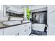 Modern bathroom with a dual sink vanity, sleek fixtures, and a luxurious soaking tub at 855 Bayway Blvd # 105, Clearwater, FL 33767