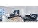 Comfortable bedroom with plush bed, side table, and modern accent chair, offering luxurious relaxation at 855 Bayway Blvd # 105, Clearwater, FL 33767