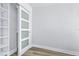 Empty bonus room or closet area with wood-look flooring and a modern sliding door at 855 Bayway Blvd # 105, Clearwater, FL 33767