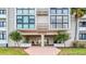 Inviting entrance with well-maintained landscaping at Commodore 855 Bayway at 855 Bayway Blvd # 105, Clearwater, FL 33767