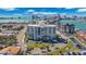 Exterior showcasing the surrounding community, landscaping, and a view of the waterfront at 855 Bayway Blvd # 105, Clearwater, FL 33767