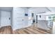 Modern kitchen with stainless steel appliances and quartz countertops open to living area at 855 Bayway Blvd # 105, Clearwater, FL 33767