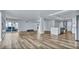 Bright open-concept living space with modern kitchen and balcony access at 855 Bayway Blvd # 105, Clearwater, FL 33767
