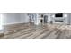 Expansive living space with a modern kitchen, fireplace, and stylish floors at 855 Bayway Blvd # 105, Clearwater, FL 33767