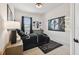 Sports themed bedroom with a decorative bed, a football theme rug, and wall art at 978 Signet Dr, Apollo Beach, FL 33572