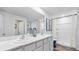 Bathroom featuring double sinks, a wide marble countertop, and a separate shower stall at 10741 Hidden Banks Gln, Parrish, FL 34219