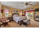 Bright main bedroom with decor, sliding glass door to backyard, and an ensuite bathroom at 127 Jennifer Dr, Rotonda West, FL 33947