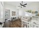Bright Bedroom with wood floor features a comfy chair, crib, window views, and play area at 1301 Jen Ma Jo Ln, Lutz, FL 33549