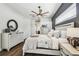 Relaxing bedroom with a stylish ceiling fan and neutral color scheme at 1301 Jen Ma Jo Ln, Lutz, FL 33549
