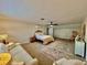 Spacious bedroom with seating area, creating a cozy and inviting atmosphere at 1301 Jen Ma Jo Ln, Lutz, FL 33549