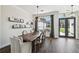 Bright dining area featuring a wooden table, comfortable seating, and a decorative wall shelf at 1301 Jen Ma Jo Ln, Lutz, FL 33549