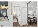 Open hallway view to the bathroom and kitchen featuring an open concept and modern design at 1301 Jen Ma Jo Ln, Lutz, FL 33549